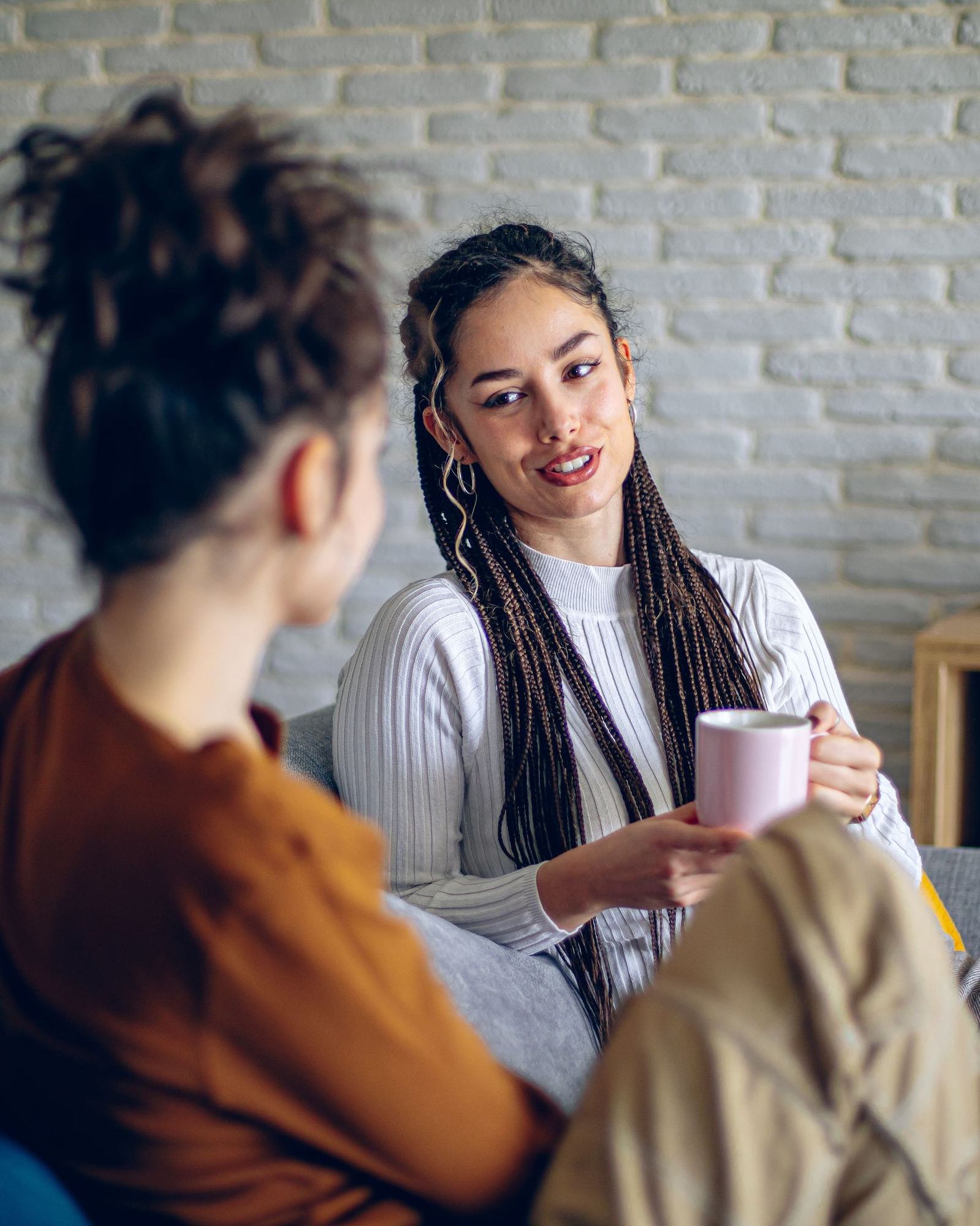 Two women sitting together having a conversation